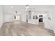 Modern kitchen with white cabinets, stainless appliances, and a center island at 55 Locust Loop Cir, Ocala, FL 34472