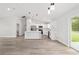Modern kitchen with white cabinets, stainless steel appliances, and a center island at 55 Locust Loop Cir, Ocala, FL 34472