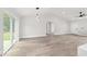 Bright, open living space with modern lighting and sliding doors to the backyard at 55 Locust Loop Cir, Ocala, FL 34472