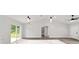 Open floor plan features living room with sliding door to back yard and ceiling fan at 55 Locust Loop Cir, Ocala, FL 34472
