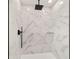 Walk-in shower with matte black hardware and marble-style tile at 55 Locust Loop Cir, Ocala, FL 34472