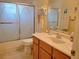 Clean bathroom with a tub, shower, and vanity at 5555 Sw 107Th St, Ocala, FL 34476