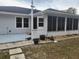 House exterior with a screened porch and patio at 5555 Sw 107Th St, Ocala, FL 34476