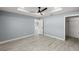 Bright bedroom with ceiling fan and wood-look floors at 7 Hemlock Radial, Ocala, FL 34472