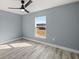 Bedroom with ceiling fan and large window at 7 Hemlock Radial, Ocala, FL 34472