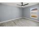 Bright bedroom with ceiling fan and window at 7 Hemlock Radial, Ocala, FL 34472