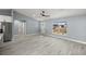 Spacious living room with light gray walls and wood-look floors at 7 Hemlock Radial, Ocala, FL 34472