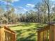 Expansive grassy backyard with mature trees at 7323 Sw 204Th Ave, Dunnellon, FL 34431