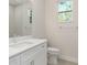 Clean bathroom with white vanity and tiled floors at 7323 Sw 204Th Ave, Dunnellon, FL 34431