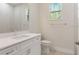 Small bathroom with white vanity and toilet at 7323 Sw 204Th Ave, Dunnellon, FL 34431