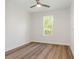 Bedroom with wood-look floors and ceiling fan at 7323 Sw 204Th Ave, Dunnellon, FL 34431