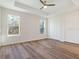 Bright bedroom with wood-look floors and large windows at 7323 Sw 204Th Ave, Dunnellon, FL 34431