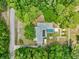 Aerial view showing home, pool, and large lot with surrounding trees at 7885 Sw 202Nd Ave, Dunnellon, FL 34431