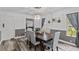 Dining room with a dark wood table and gray chairs at 7885 Sw 202Nd Ave, Dunnellon, FL 34431