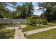 Landscaped garden with brick paths and a birdbath at 7885 Sw 202Nd Ave, Dunnellon, FL 34431