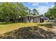 Side view of a house with a detached garage at 7885 Sw 202Nd Ave, Dunnellon, FL 34431