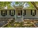 Front entrance of a cozy house with a covered porch at 7885 Sw 202Nd Ave, Dunnellon, FL 34431