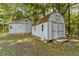 Two storage sheds in a wooded backyard setting at 7885 Sw 202Nd Ave, Dunnellon, FL 34431