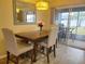 Bright dining room with table and chairs, and access to patio at 8187 Sw 60Th Ter, Ocala, FL 34476