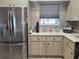 Stainless steel refrigerator and kitchen cabinets at 8187 Sw 60Th Ter, Ocala, FL 34476