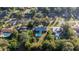 Aerial view of neighborhood with several homes and pools at 820 Ne 42Nd Ter, Ocala, FL 34470