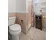 Clean bathroom with shower, toilet and pedestal sink at 820 Ne 42Nd Ter, Ocala, FL 34470