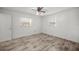 Simple bedroom with wood-look floors and ample light at 820 Ne 42Nd Ter, Ocala, FL 34470