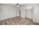 Simple bedroom featuring wood-look floors and a large closet at 820 Ne 42Nd Ter, Ocala, FL 34470