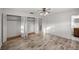 Spacious bedroom featuring wood-look floors and large closets at 820 Ne 42Nd Ter, Ocala, FL 34470