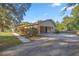 Home exterior showcasing carport and landscaping at 820 Ne 42Nd Ter, Ocala, FL 34470