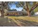 Brick ranch house with mature landscaping at 820 Ne 42Nd Ter, Ocala, FL 34470