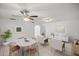 Comfortable living room featuring modern furniture, a ceiling fan and light tile flooring at 820 Ne 42Nd Ter, Ocala, FL 34470