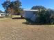 Backyard view of a house with a grassy area at 8973 Sw 101St Ln, Ocala, FL 34481