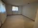 Bedroom with light colored carpet and a window with curtains and blinds at 8973 Sw 101St Ln, Ocala, FL 34481