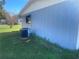 Exterior side view of home with air conditioner and landscaping at 8973 Sw 101St Ln, Ocala, FL 34481