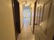 Hallway has tile flooring and wood trim at 8973 Sw 101St Ln, Ocala, FL 34481