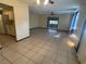 Open living room and kitchen area with tile floors at 8973 Sw 101St Ln, Ocala, FL 34481