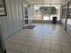 Enclosed patio featuring tiled floor, screens, exterior entrance and door at 8973 Sw 101St Ln, Ocala, FL 34481