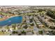 Aerial view of homes in a residential community near a lake at 9211 Sw 66Th Loop, Ocala, FL 34481