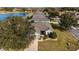 Single-story home with landscaped yard and driveway, near a lake at 9211 Sw 66Th Loop, Ocala, FL 34481