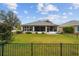 House with fenced backyard and grassy lawn at 9211 Sw 66Th Loop, Ocala, FL 34481