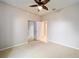 Spacious bedroom with carpet flooring and ceiling fan at 9211 Sw 66Th Loop, Ocala, FL 34481