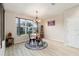 Charming dining area with a round table, chandelier, and area rug at 9211 Sw 66Th Loop, Ocala, FL 34481