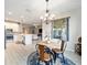 Bright dining room featuring a chandelier and round wooden table at 9211 Sw 66Th Loop, Ocala, FL 34481