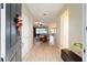 Bright entryway with dark gray door and light wood-look flooring at 9211 Sw 66Th Loop, Ocala, FL 34481