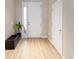 Simple entryway with white door and light wood-look flooring at 9211 Sw 66Th Loop, Ocala, FL 34481