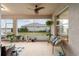 Cozy screened porch with wicker seating and lake view at 9211 Sw 66Th Loop, Ocala, FL 34481