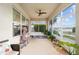 Spacious screened porch with ceiling fan, cat tree, and potted plants at 9211 Sw 66Th Loop, Ocala, FL 34481