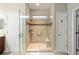 Spacious walk-in shower with tiled walls and built-in seat at 9211 Sw 66Th Loop, Ocala, FL 34481