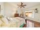 Cozy bedroom with hardwood floors and a ceiling fan at 9267 Sw 91St Cir, Ocala, FL 34481